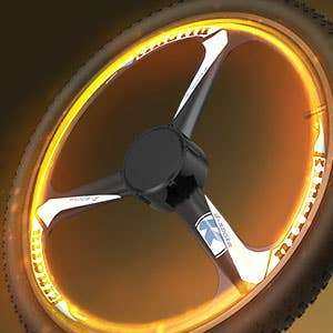 Goldoro Electric Bike 26" X7 aluminum alloy wheel with glowing rim design.