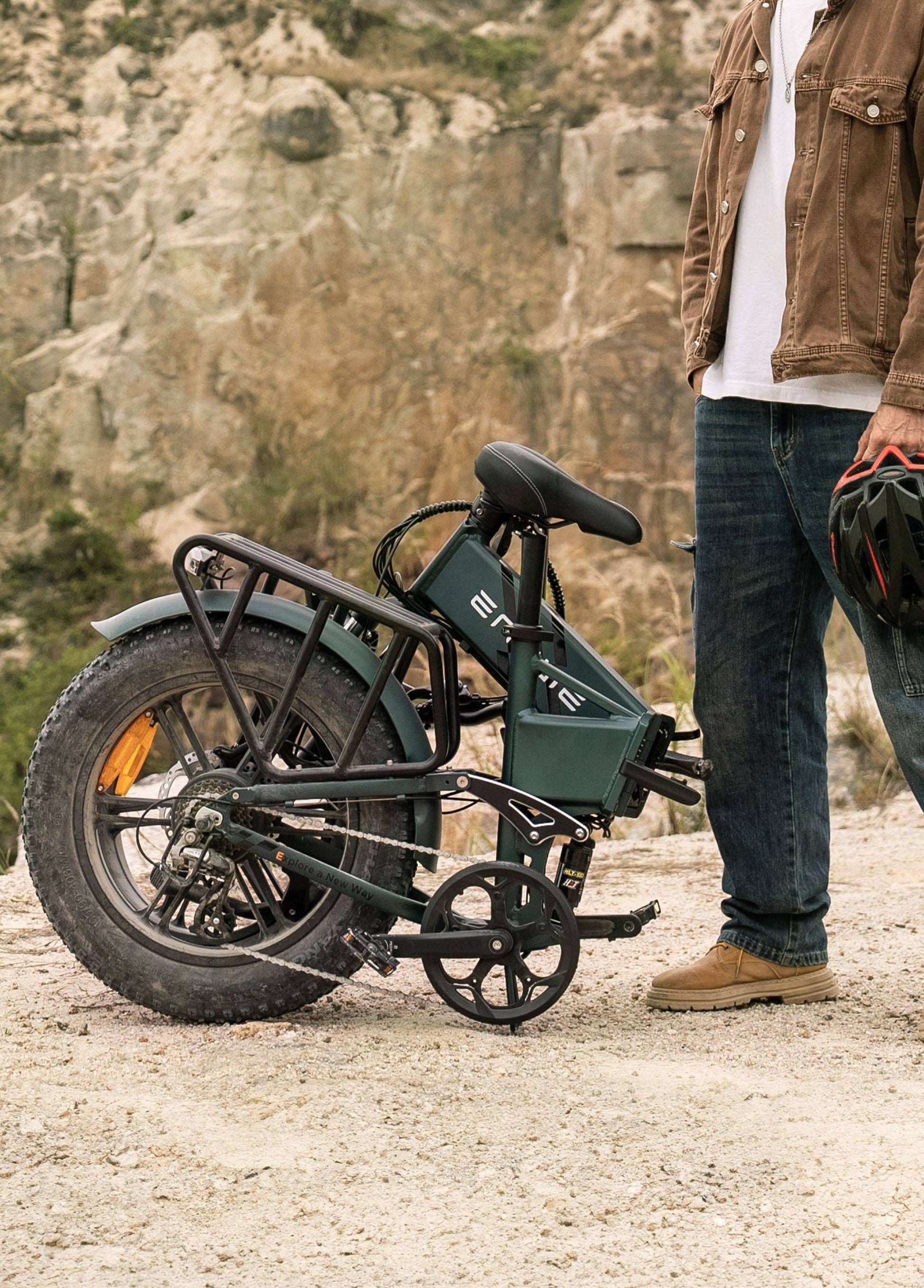 Folding Engwe Engine Pro 2.0 e-bike in midnight blue, with 1200W peak motor, designed for outdoor adventures.